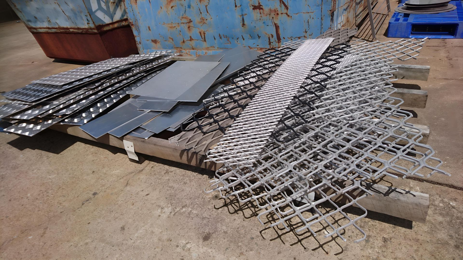A Bunch Of Metal Pieces Are Laying On The Ground — Brian Martin's Sheet Metal In Moranbah, QLD