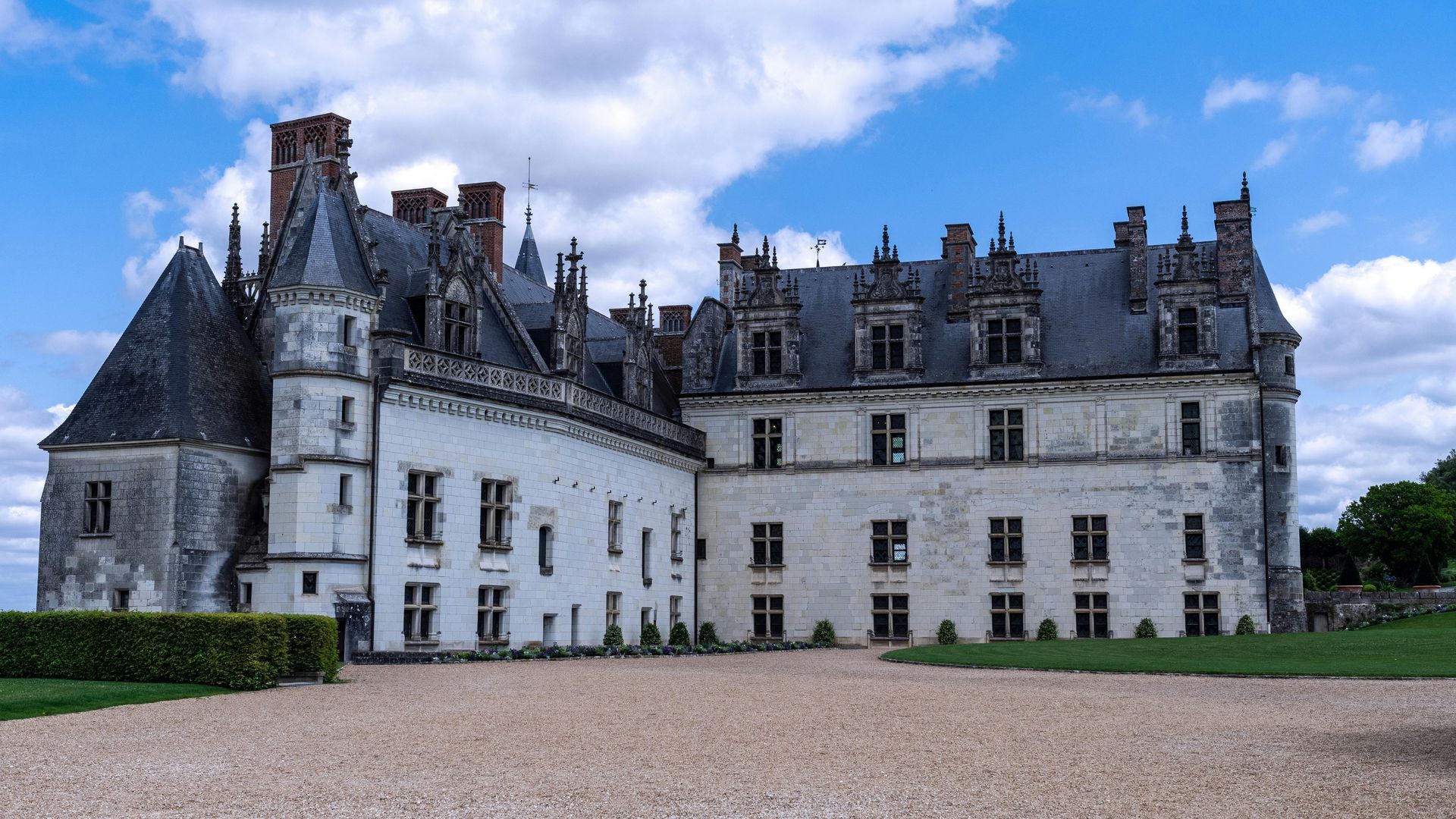 Historic château in the Loire Valley, showcasing a mix of Gothic and Renaissance architectural styles with a scenic courtyard