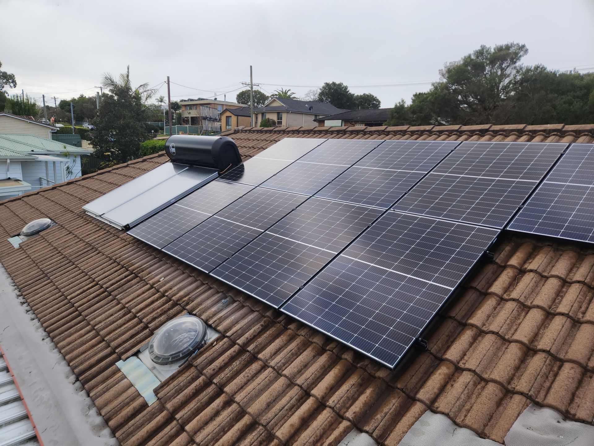 A Close Up of a Faucet With Steam Coming Out of It — Solar Services in Erina, NSW