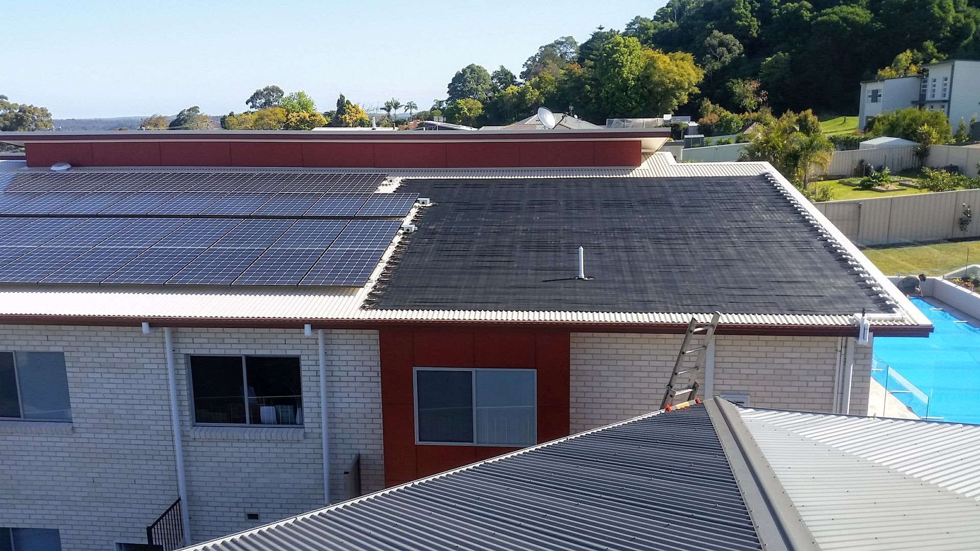 Solar Water Heaters on A Rooftop: panels and solar lines — Solar Services in Erina, NSW
