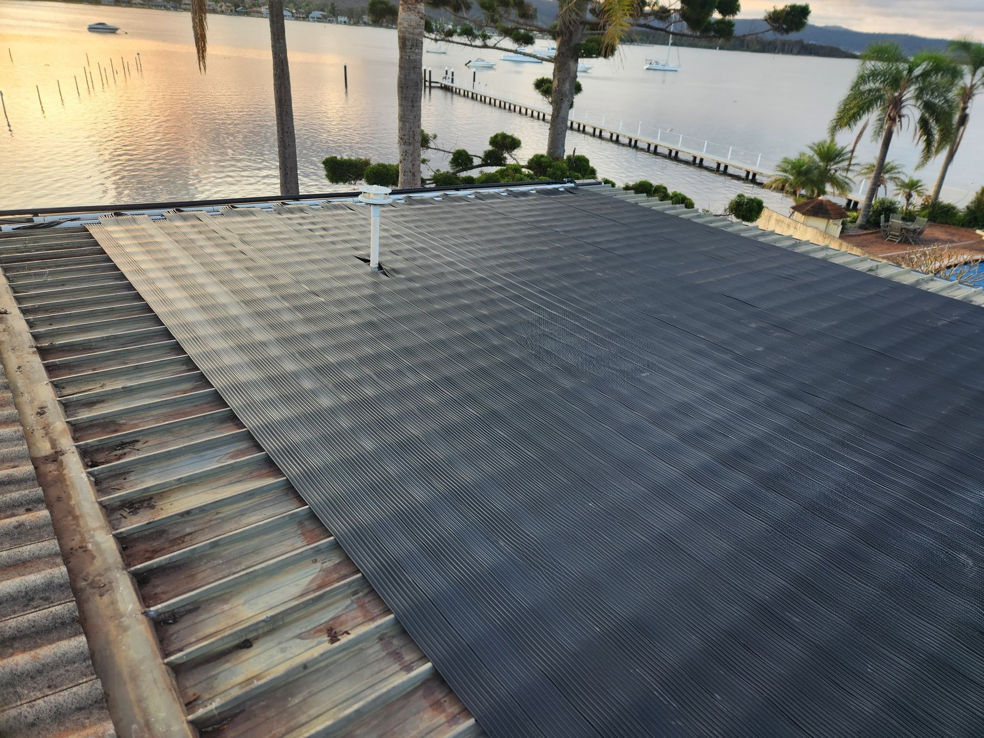 A House With a Lot of Solar Panels on the Roof — Solar Services in Terrigal, NSW