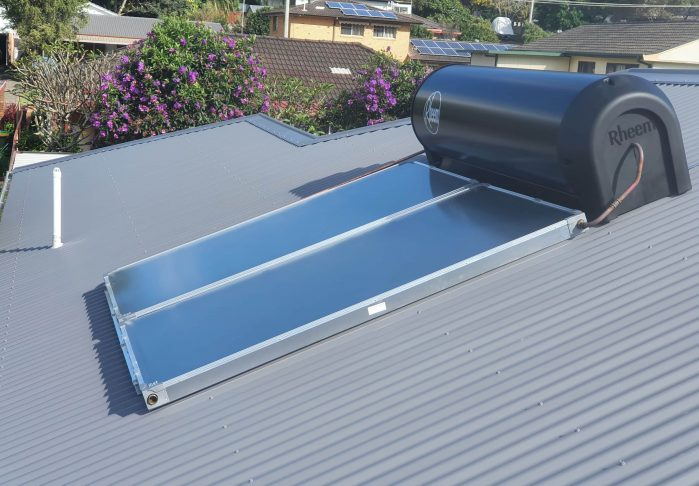 A Solar Water Heater is on the Roof of a House — Solar Services in Erina, NSW