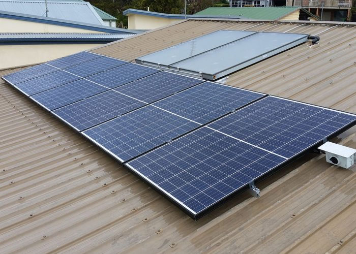 Solar Panels on a Corrugated Metal Roof — Solar Services in Erina, NSW
