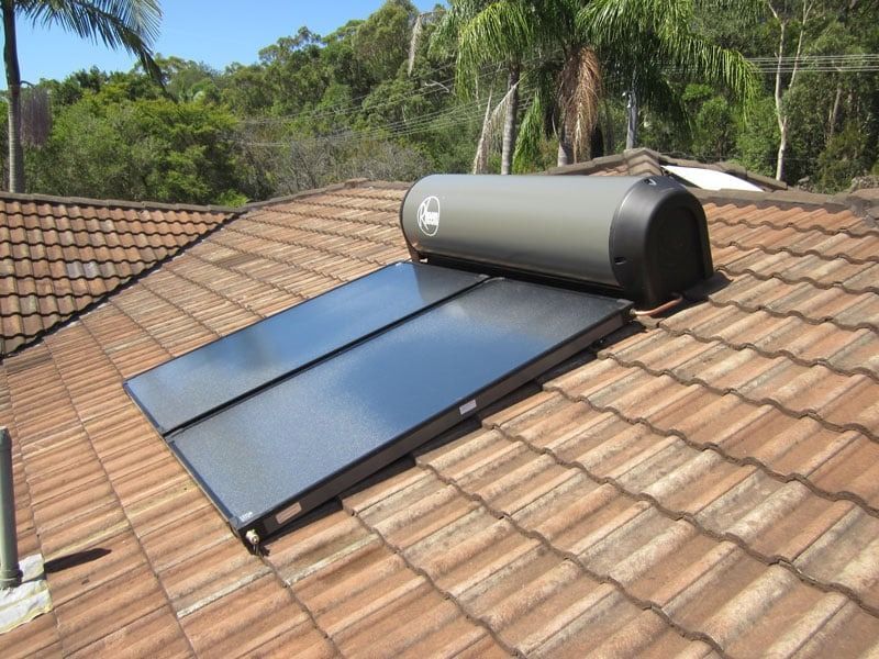 A Solar Panel is Sitting on Top of a Tiled Roof — Solar Services in Erina, NSW