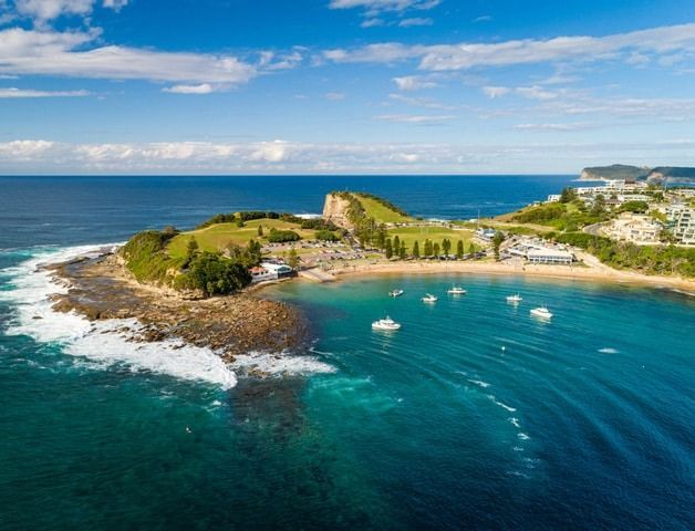 An Aerial View of a Small Island in the Middle of the Ocean — Solar Services in Terrigal, NSW