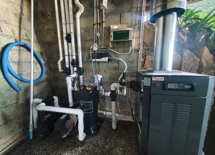 A Room With a Lot of Pipes and a Heater — Solar Services in Erina, NSW