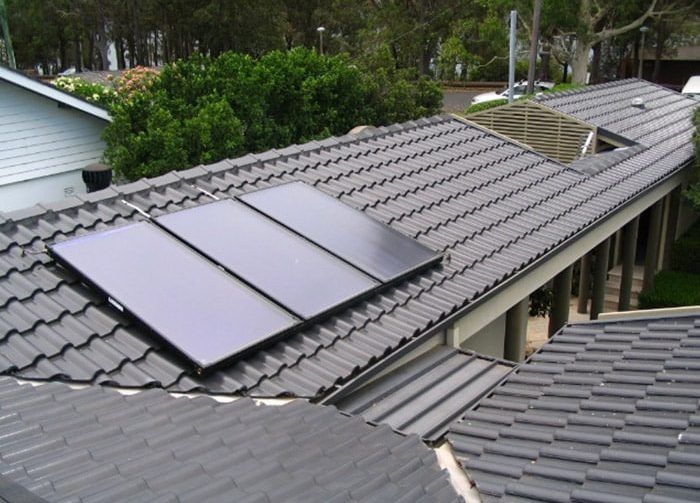 Two Solar Panels Are on the Roof of a House — Solar Services in Kincumber, NSW