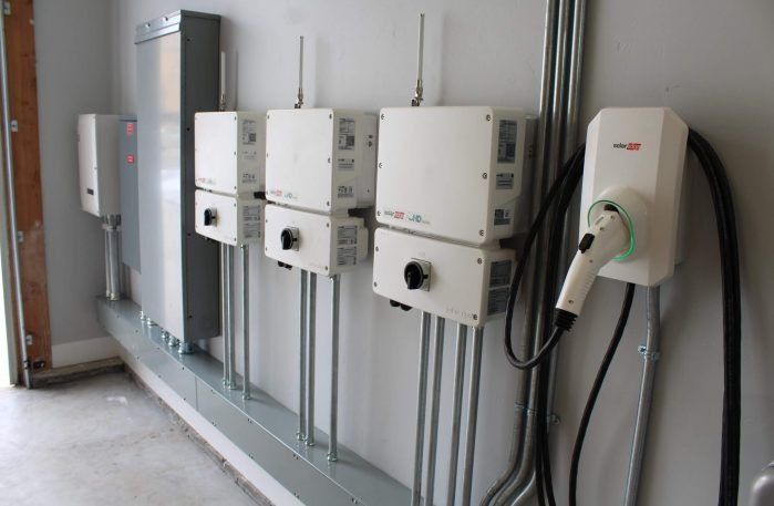A Row of Electrical Boxes Are Lined Up on a Wall — Solar Services in Erina, NSW