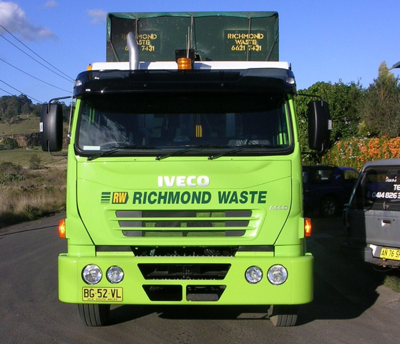 The front of a Richmond Waste truck is parked on the road — Hasti Skips in Ballina, NSW