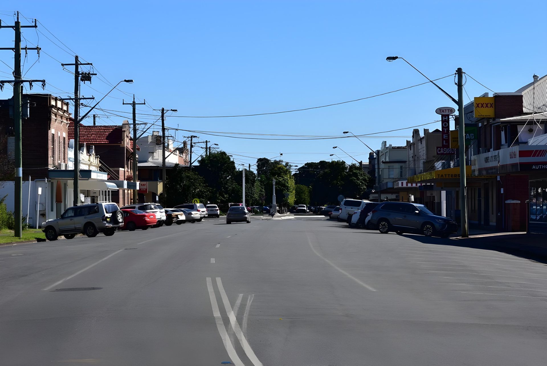 Street Lined With Cars Parked on Either Side, Buildings, and Power Lines — Hasti Skips in Casino, NSW