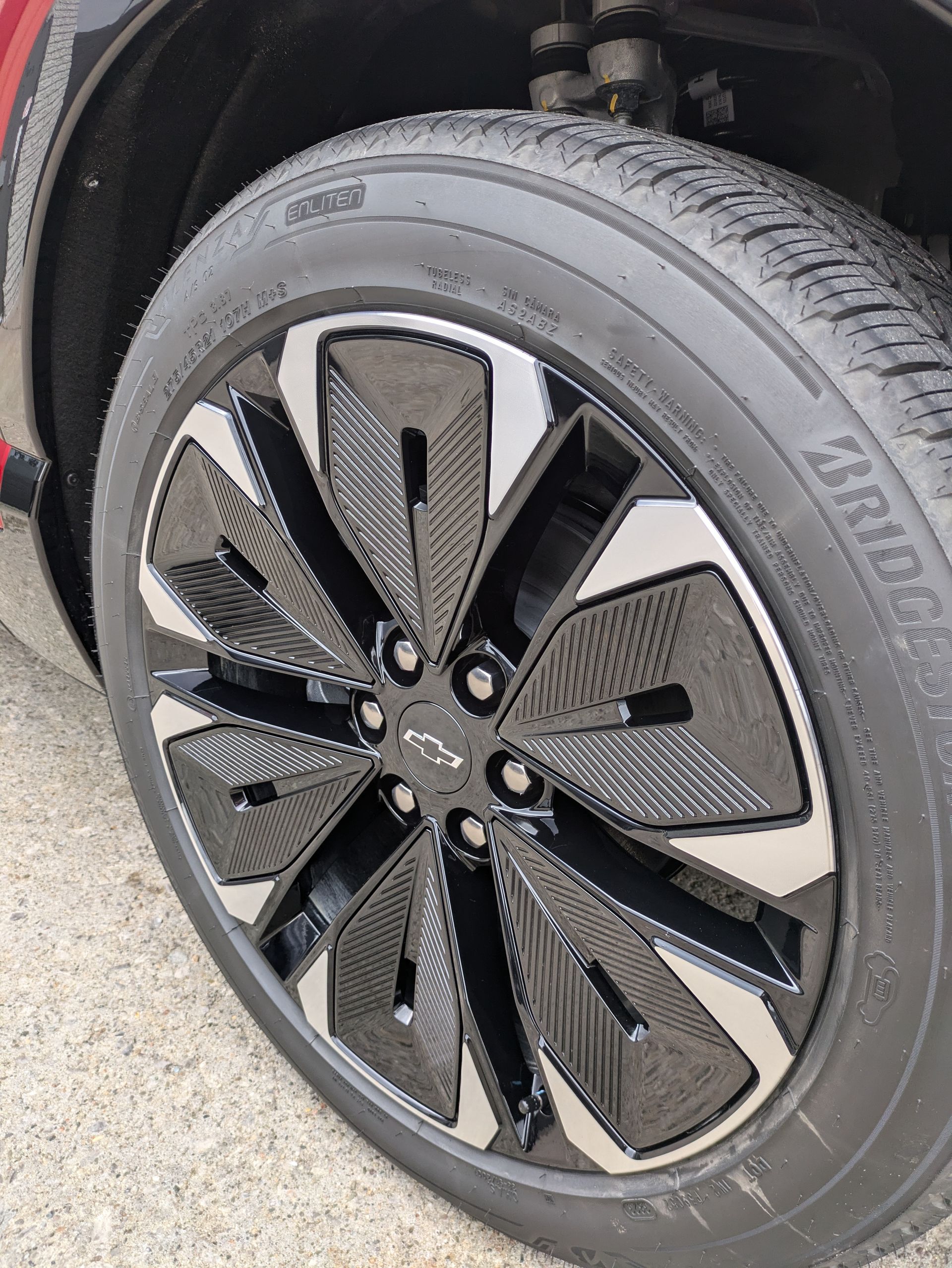 A close up of a tire on a black car