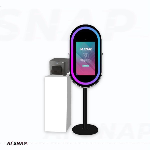 Oval black photo booth kiosk with neon purple-blue glow beside a white pedestal on a white background