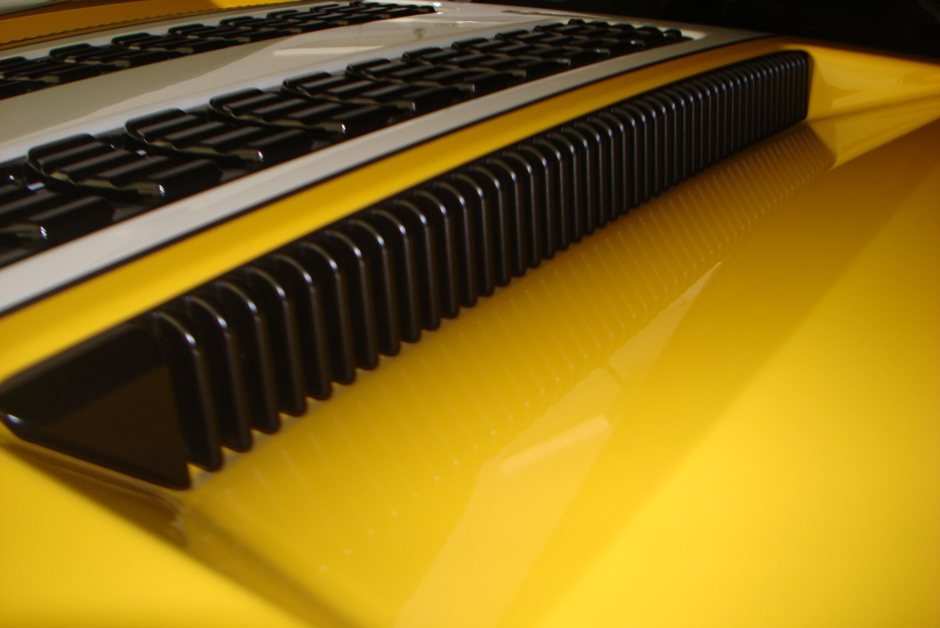 Photo showing yellow GT with black side vents,