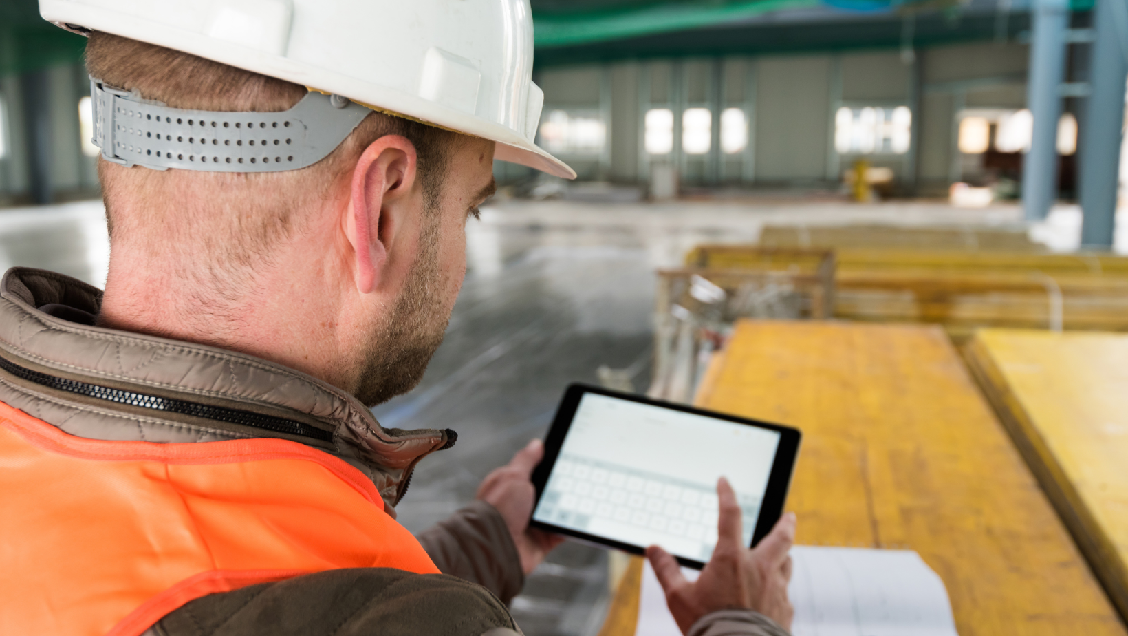 Field professional reviewing work on a tablet