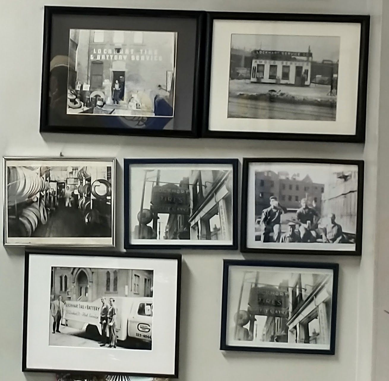 Six black-framed black-and-white photos arranged on a wall in a grid.