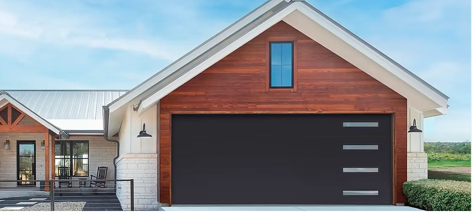 Modern house exterior with white trim, wood siding, and a large dark garage door