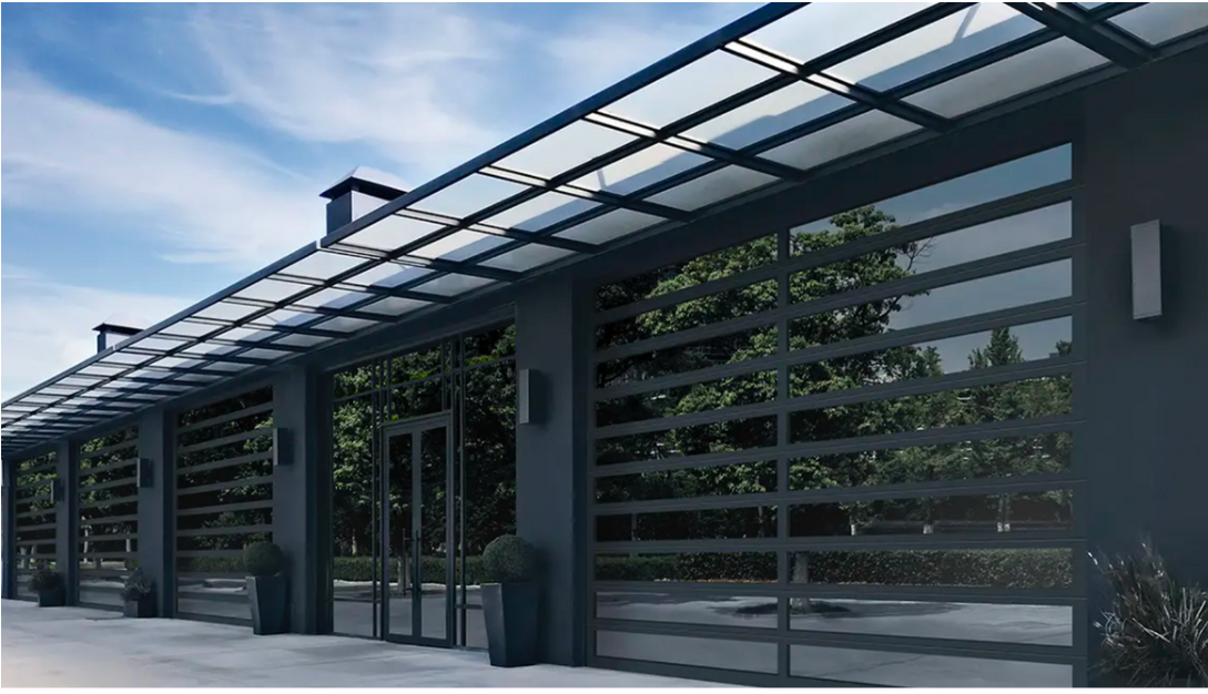 Modern building entrance with dark metal pergola, glass walls, and potted plants along a walkway
