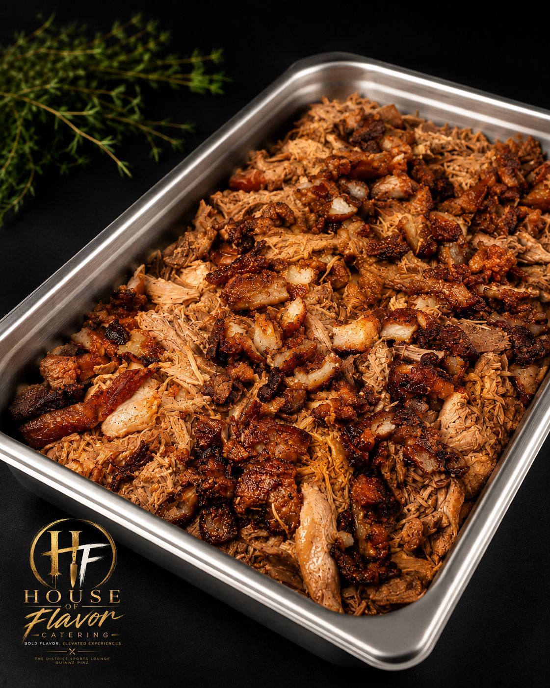 Tray of seasoned roasted chicken pieces on a stainless steel pan