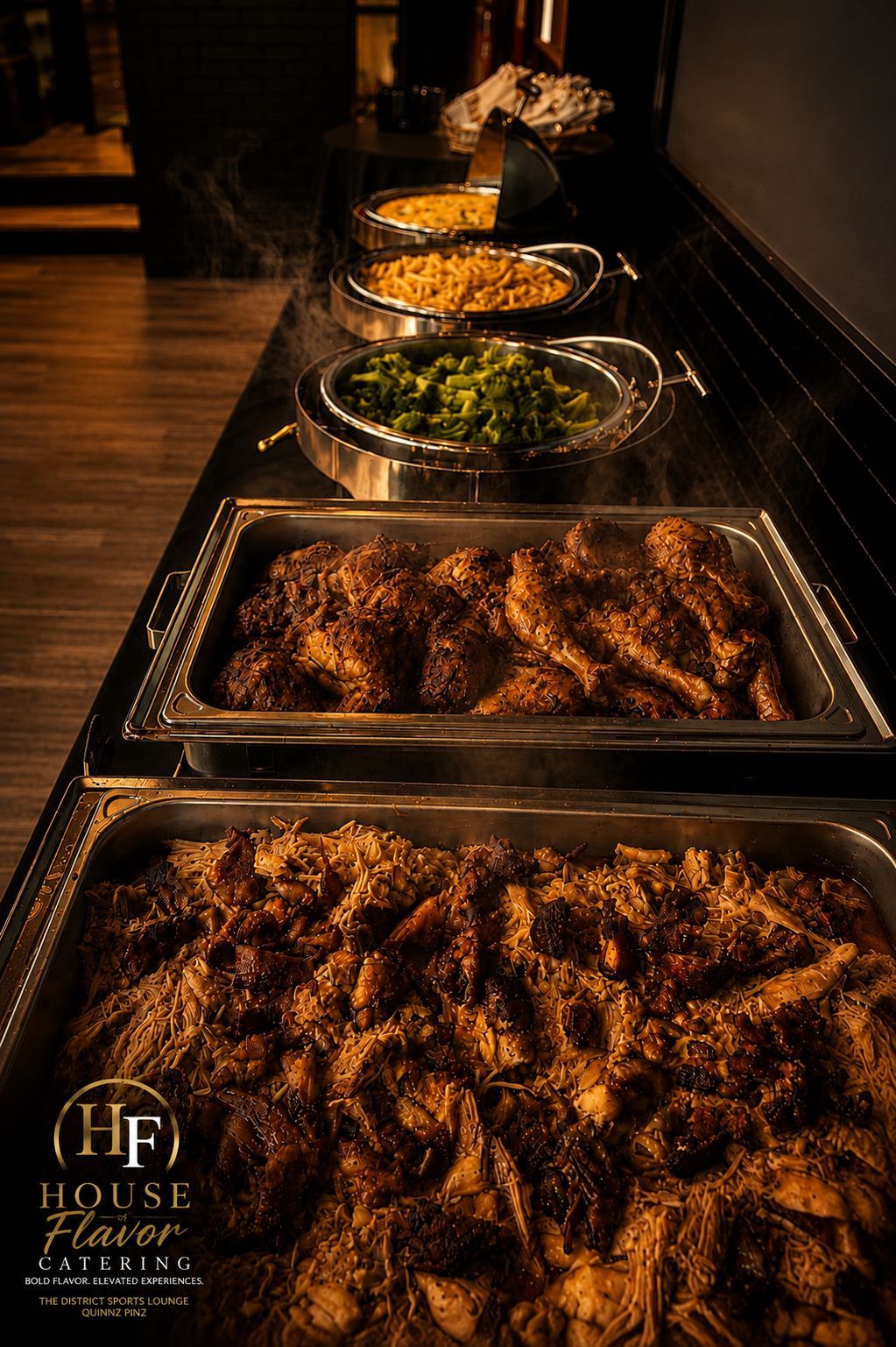 Buffet trays of fried chicken, greens, and sides on a warmly lit serving line