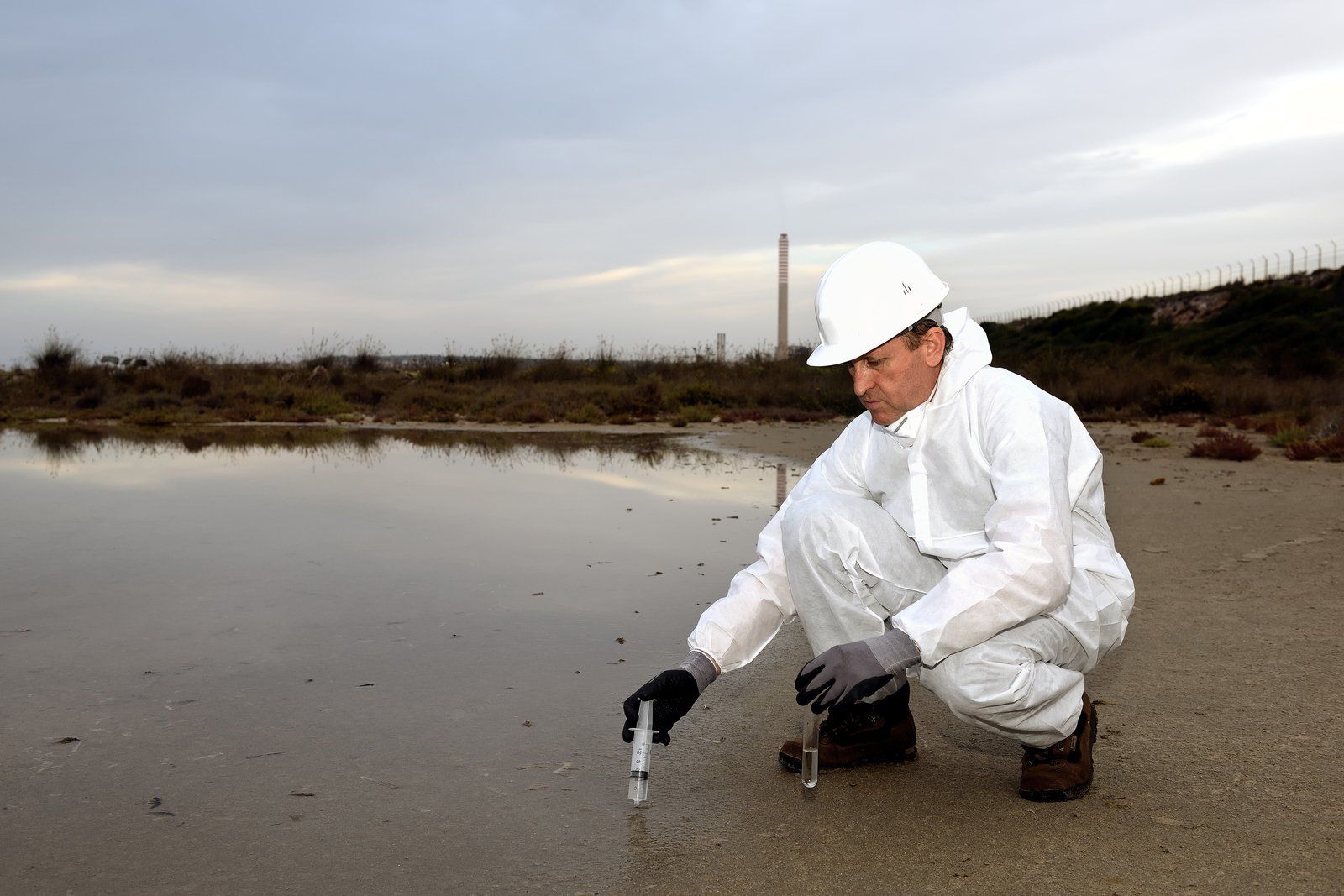 worker injecting the soil