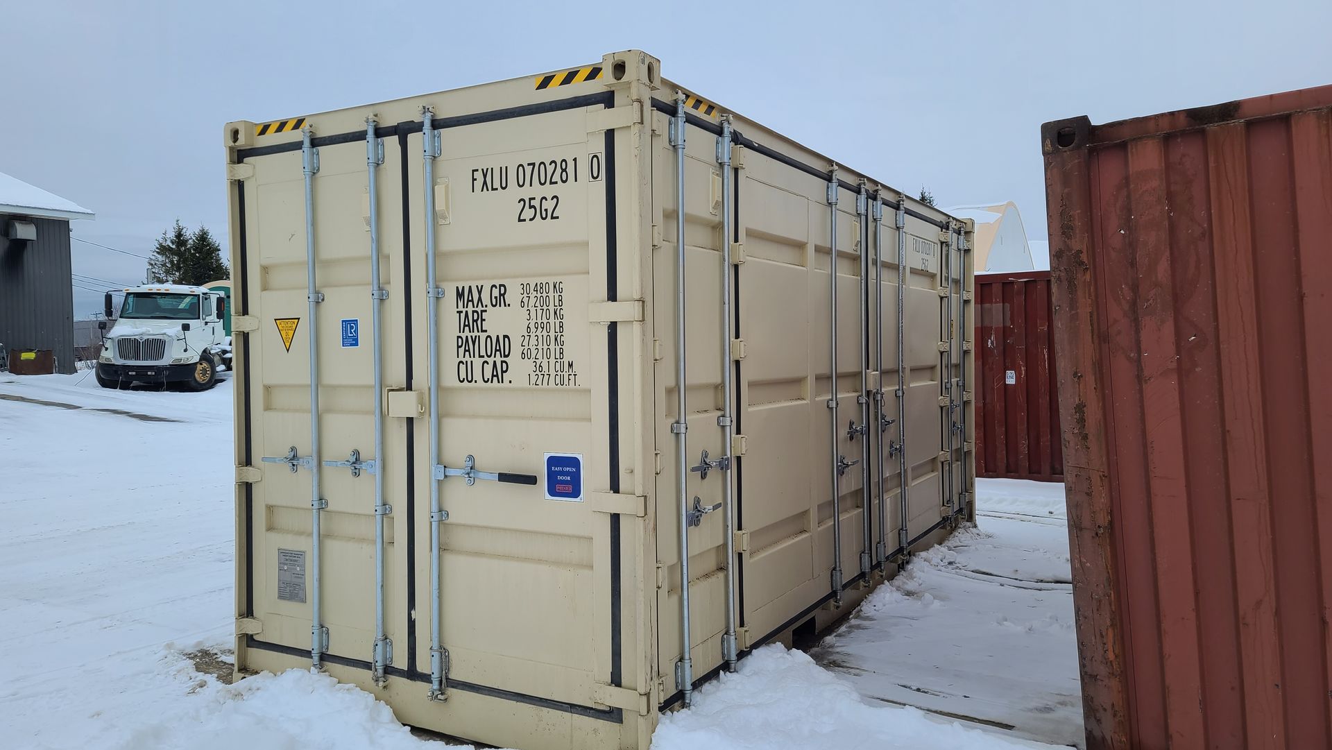 Cover-Tech Beige shipping container in snowy outdoor setting.