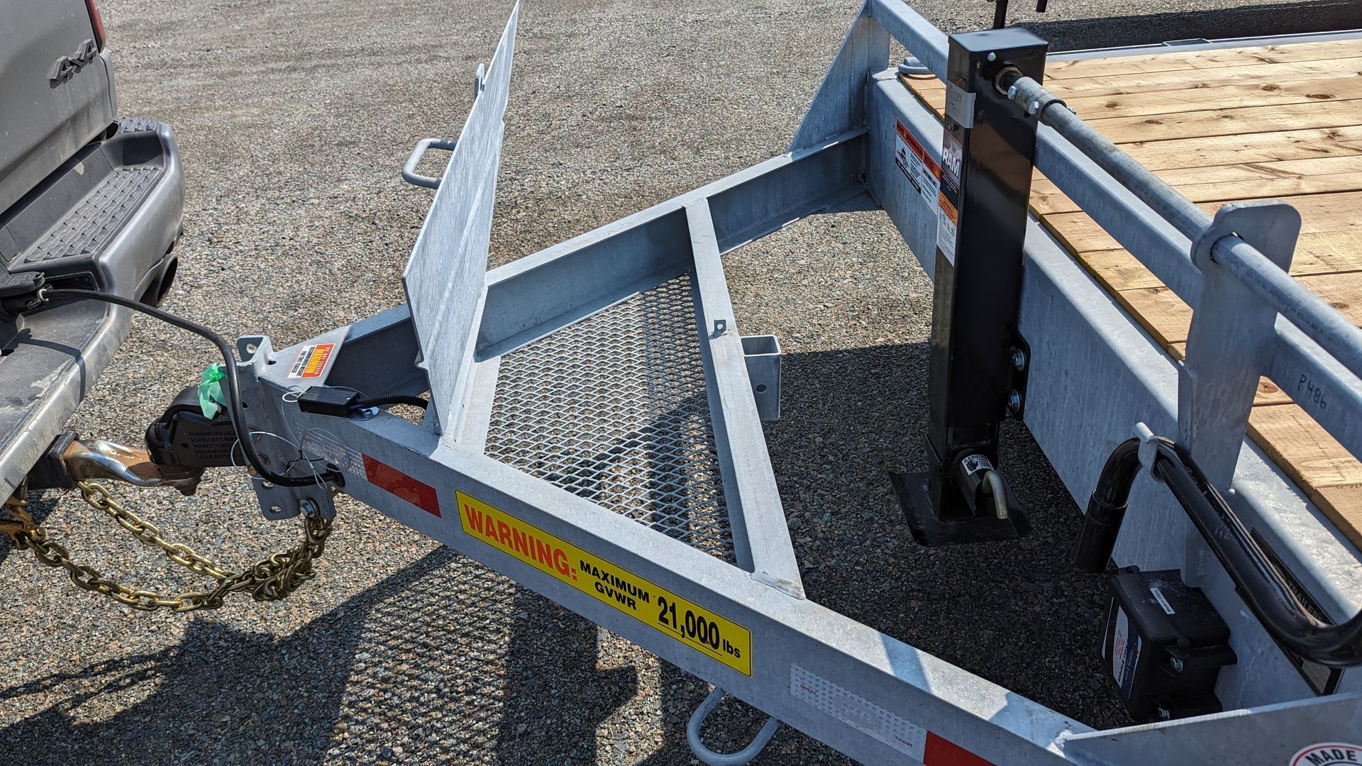 A trailer is attached to the back of a truck.