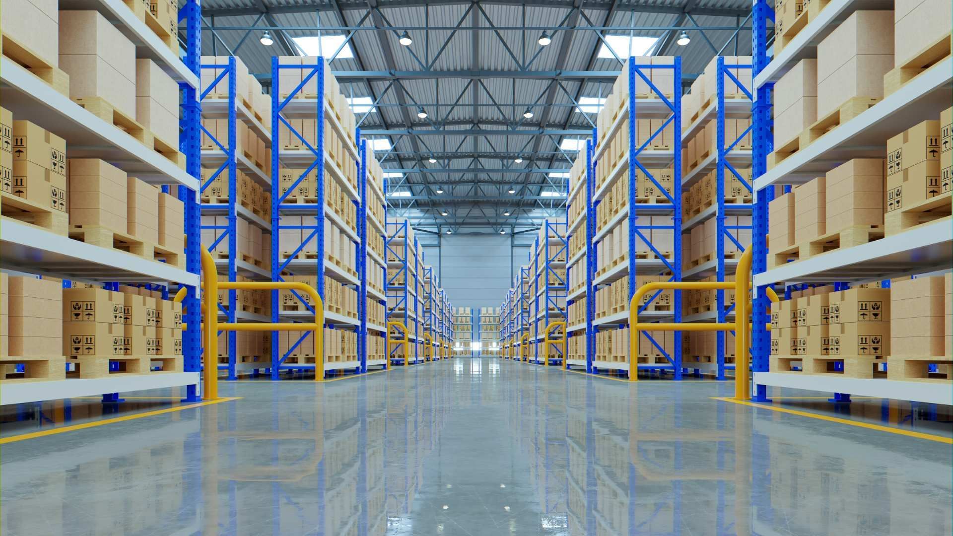 Aisle of a warehouse with tall shelving full of boxes and a polished floor under bright industrial lights
