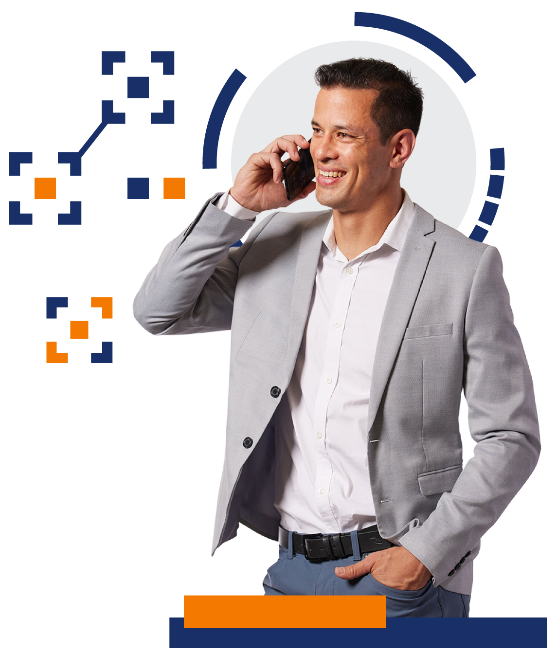 A man in a suit is talking on a cell phone