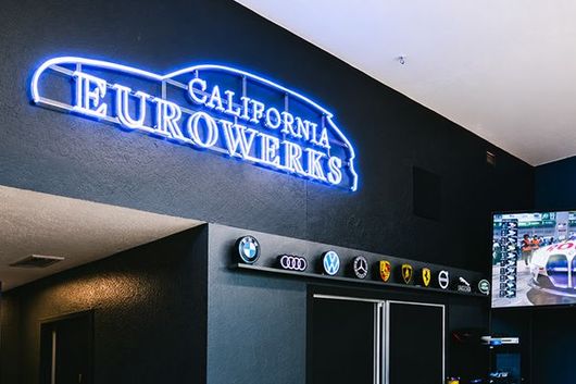 Neon California Neuroworks sign above a dark office entrance