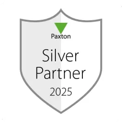 Paxton Silver Partner 2025 badge with gray shield and green accent