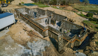 An aerial view of a swimming pool under construction.