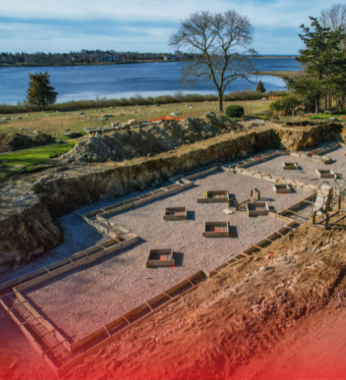 An aerial view of a very old building with a lake in the background.