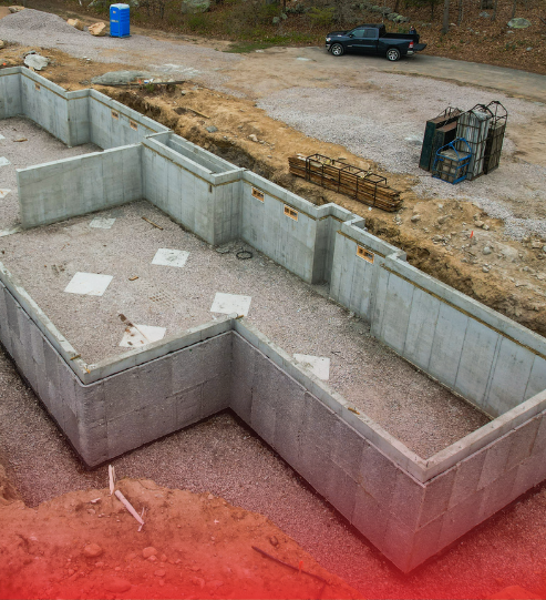 An aerial view of a concrete foundation under construction.