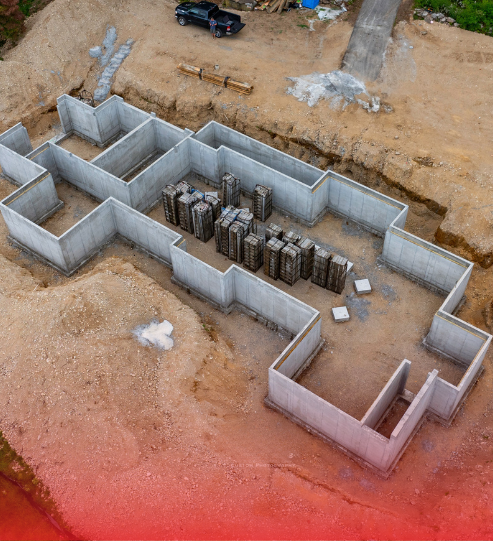 An aerial view of a concrete basement under construction.