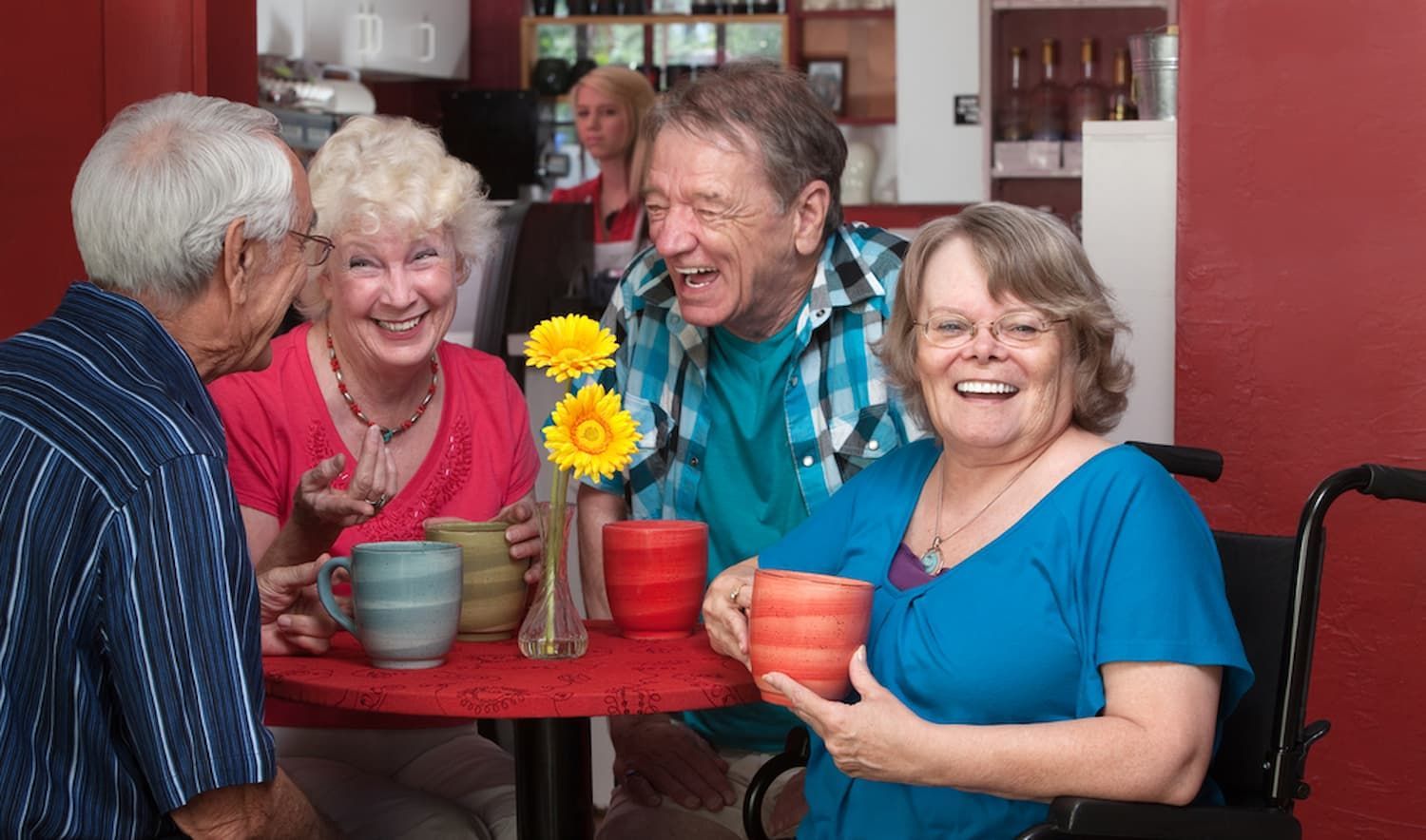 A Group of Elderly People Are Sitting at A Table Drinking Coffee — Wonder Care Australia Pty Ltd in Kearneys Spring, QLD
