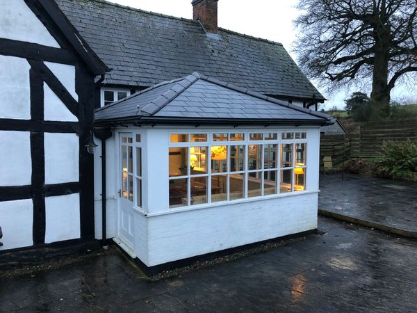 Local roofing contractor working on a roof in Oswestry