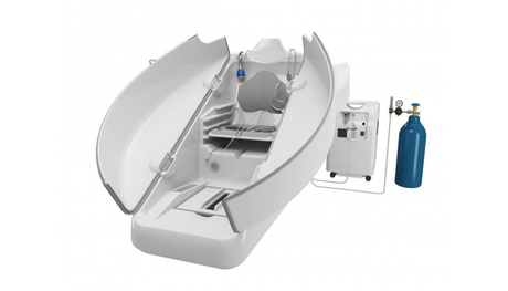 Open medical imaging scanner with patient bed and attached blue oxygen tank