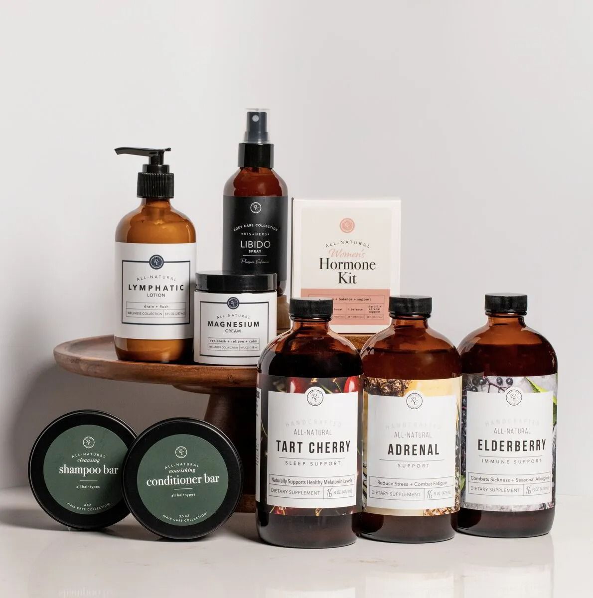 Assorted amber skincare bottles and jars arranged on wooden shelves against a light background