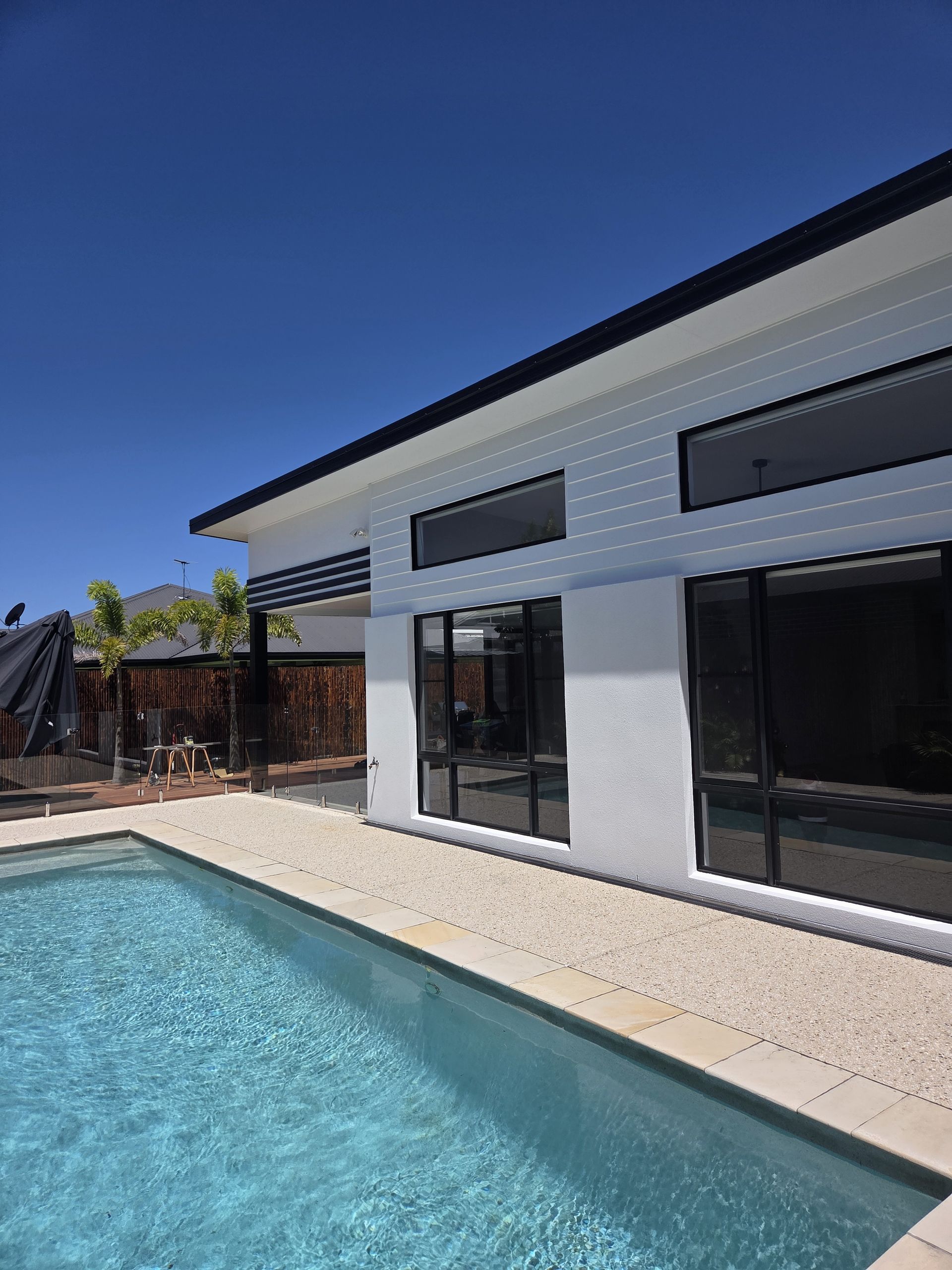 Exterior View of House with Blue Pool — MVP Painting Professionals in Sunshine Coast, QLD