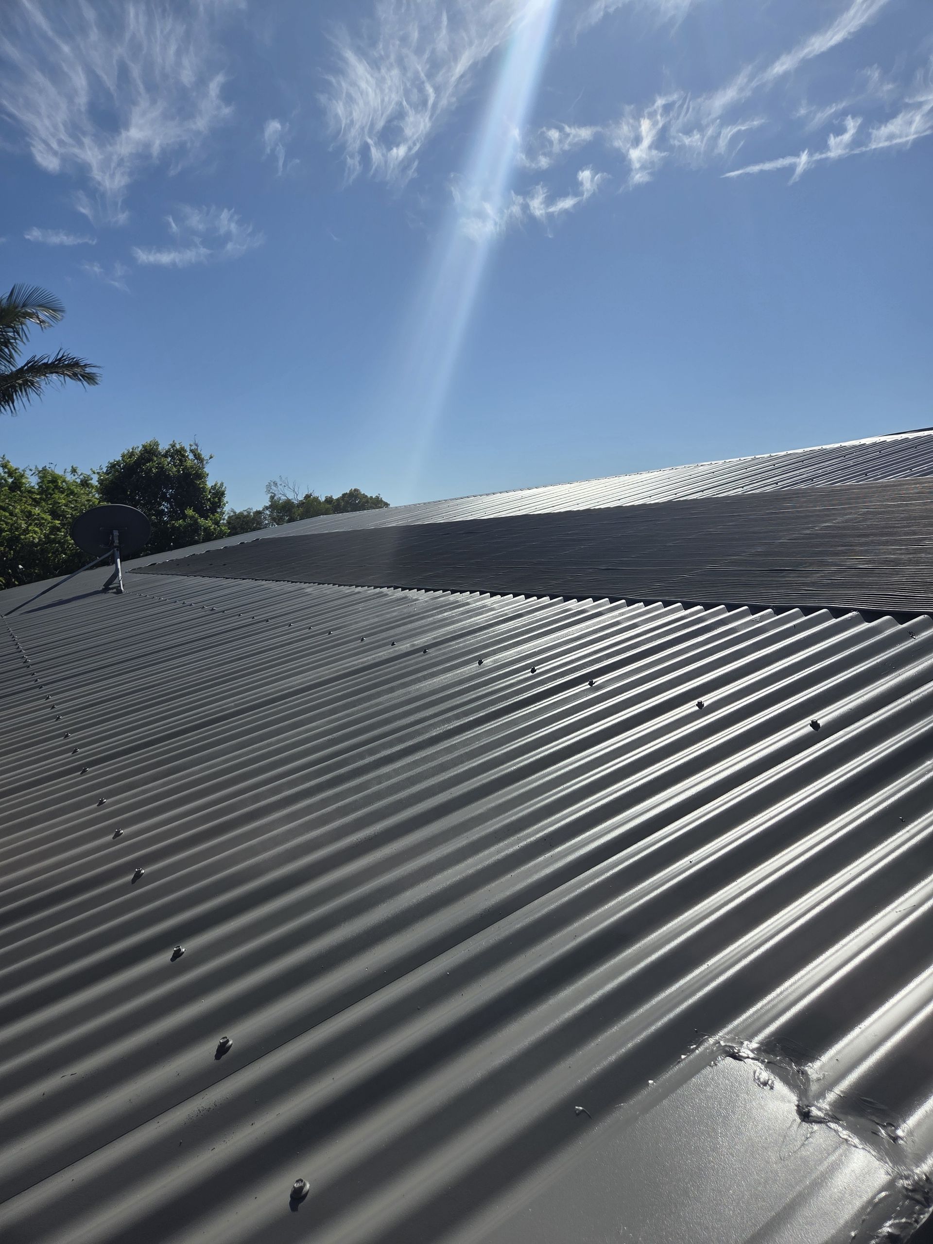 Grey Roof with Blue Sky — MVP Painting Professionals in Caloundra, QLD