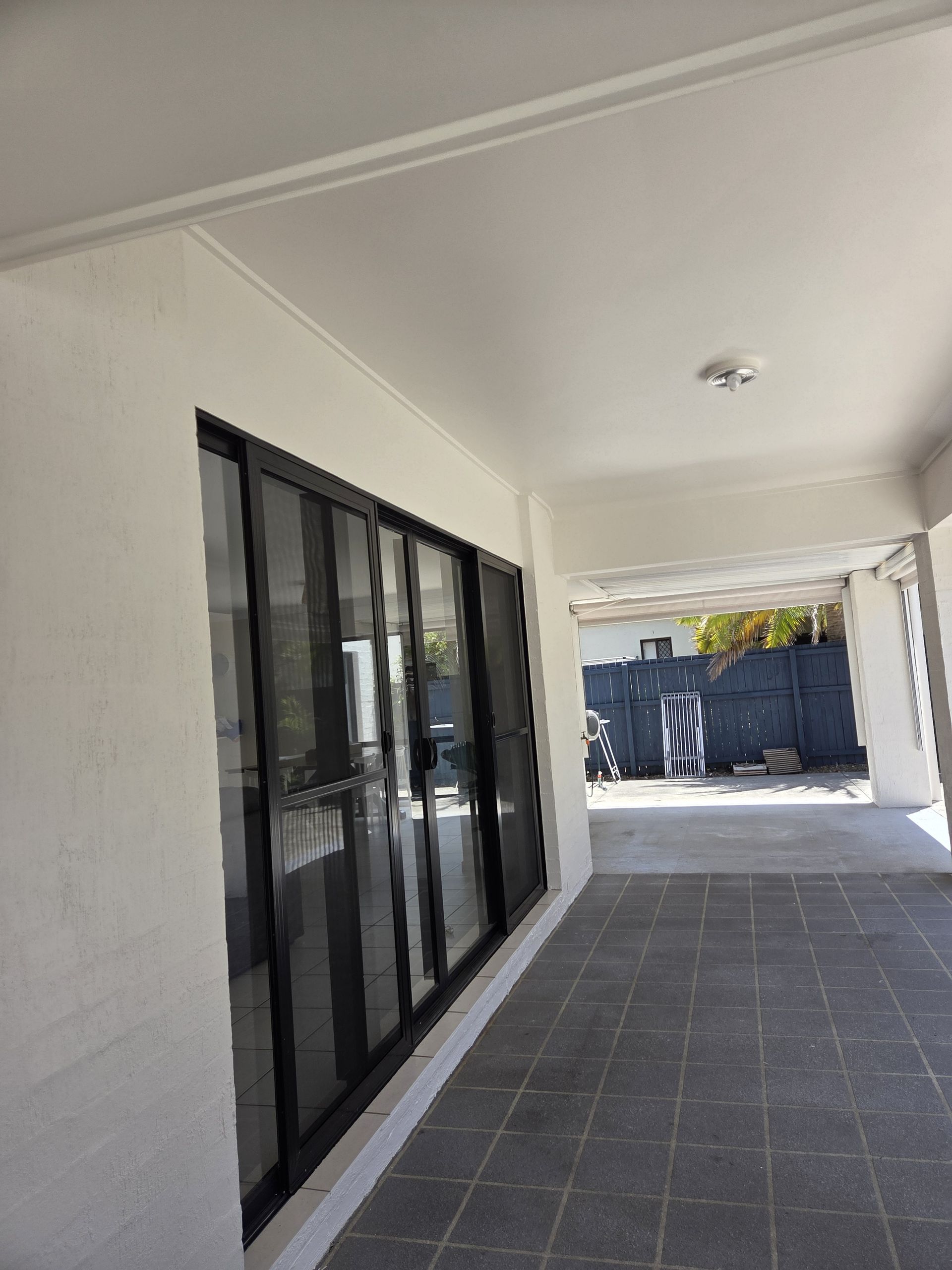 Outdoor Area with Sliding Door and White Walls — MVP Painting Professionals in Sippy Downs, QLD