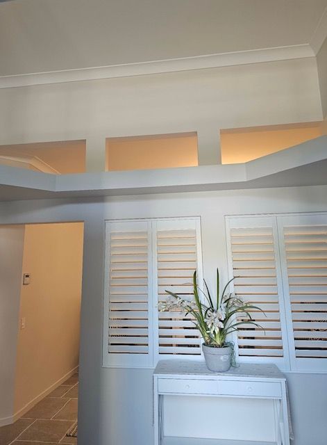 Interior View: Light-coloured Walls With Shutters, Decorative Shelf — MVP Painting Professionals in Maroochydore, QLD