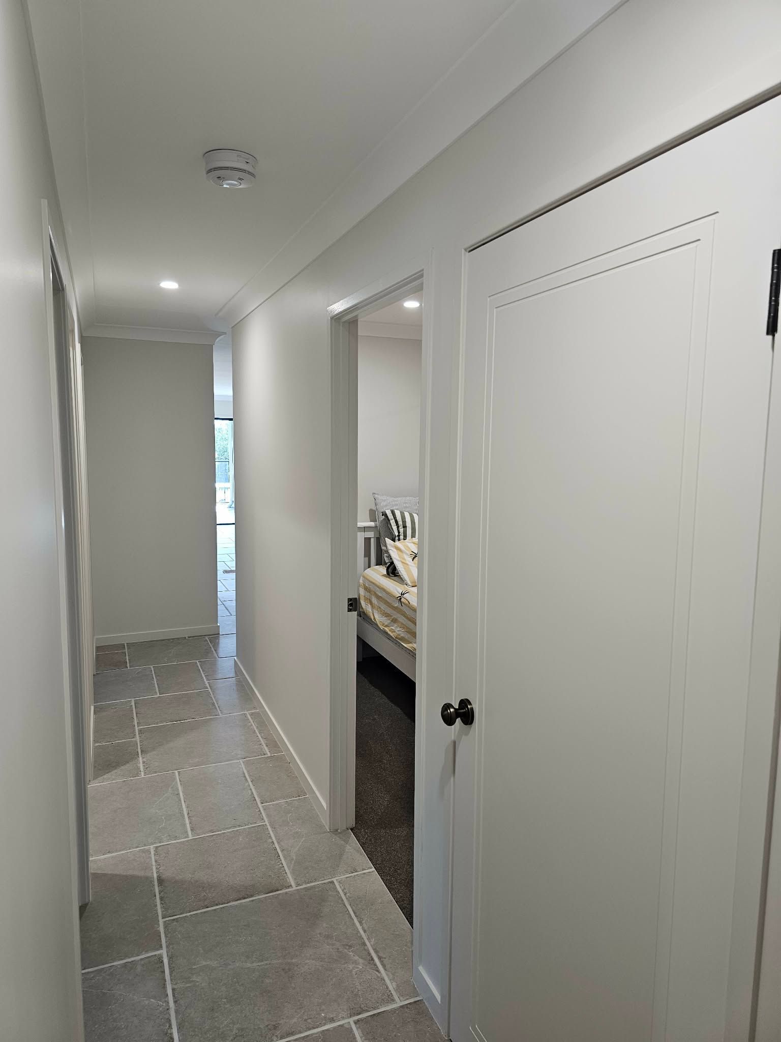 A Ceiling With a Dark Gray and Beige Color Block Design — MVP Painting Professionals in Kawana, QLD