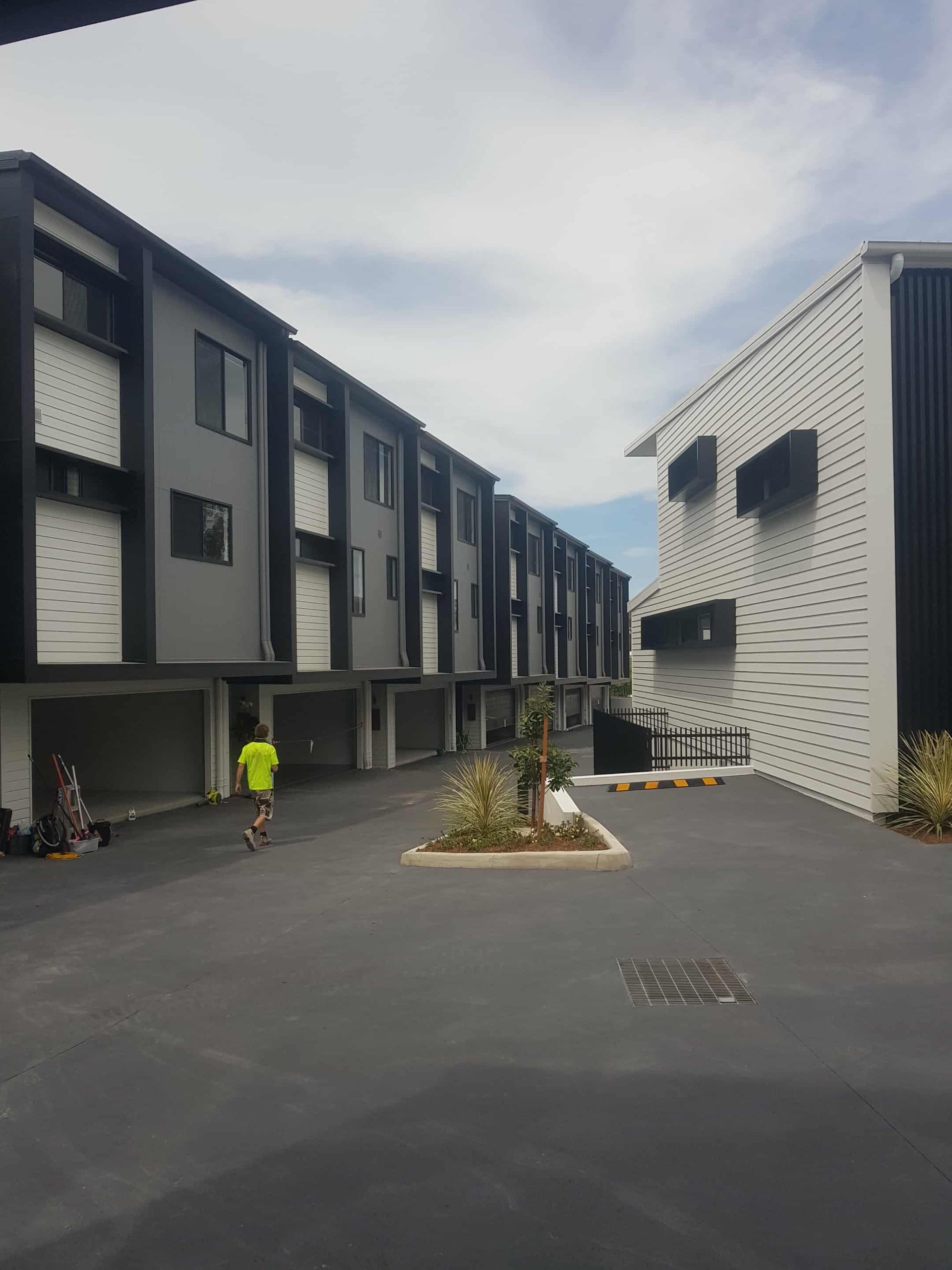 Charcoal Coloured Town Houses with Construction Worker — MVP Painting Professionals in Buderim, QLD