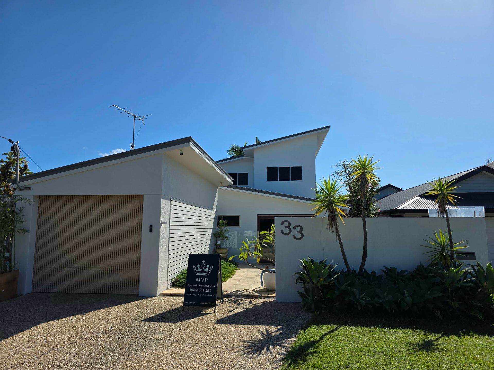 White exterior of house with blue sky background — MVP Painting Professionals in Sunshine Coast, QLD