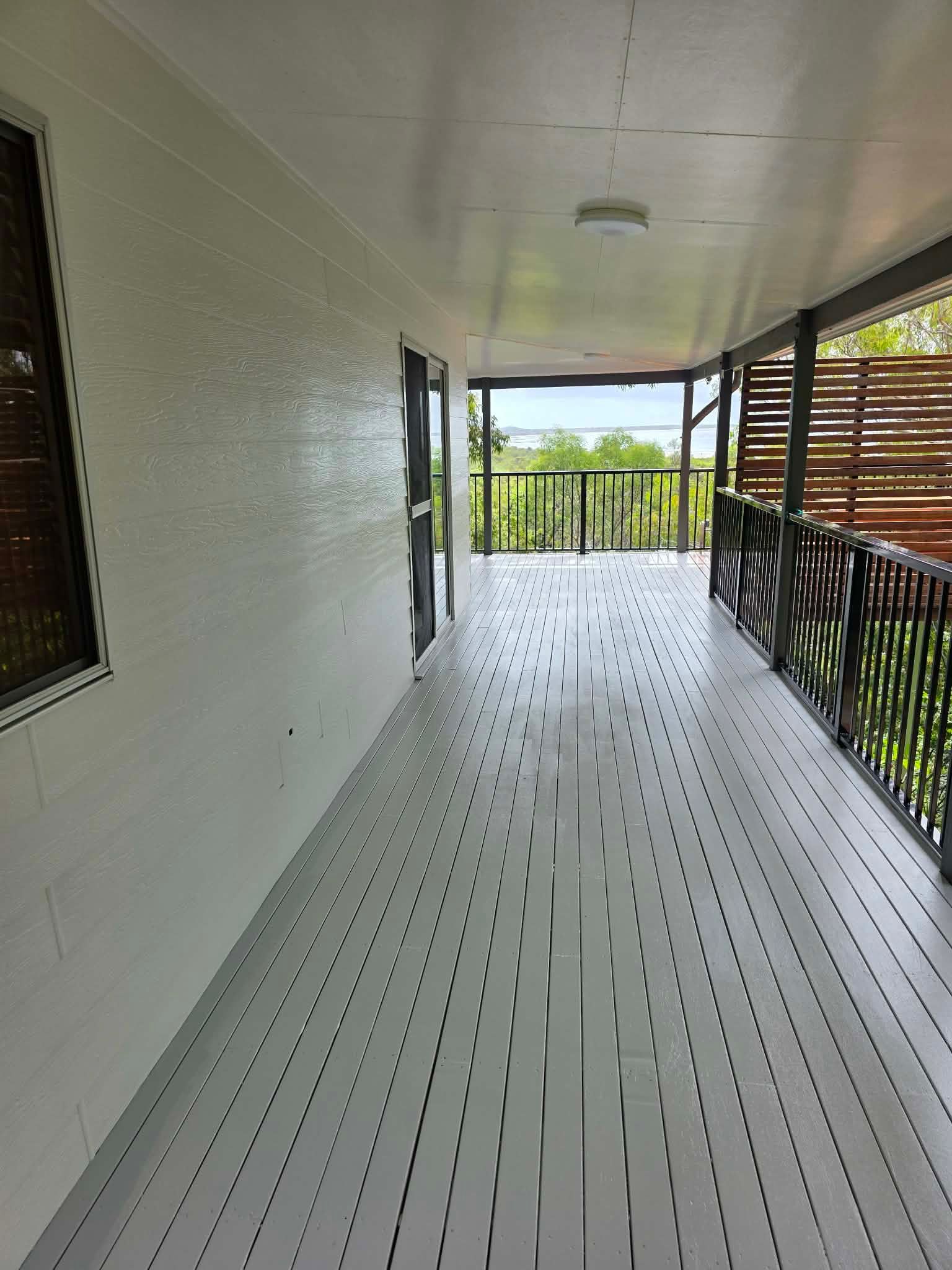 Outside Deck With Grey Walls,and Black Railing — MVP Painting Professionals in Sunshine Coast, QLD