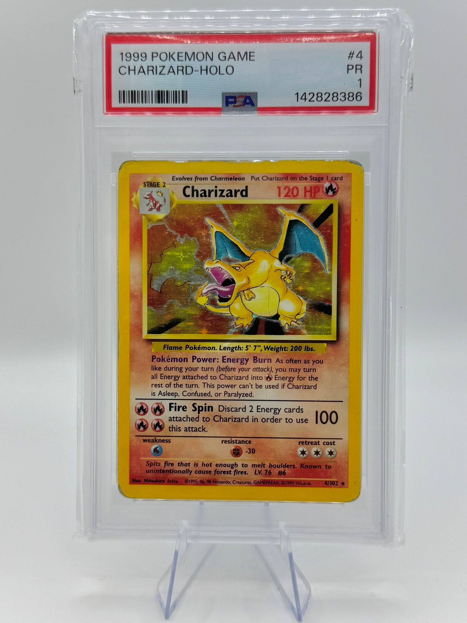 Pokémon trading card game booster pack in yellow retail packaging on a textured wooden surface