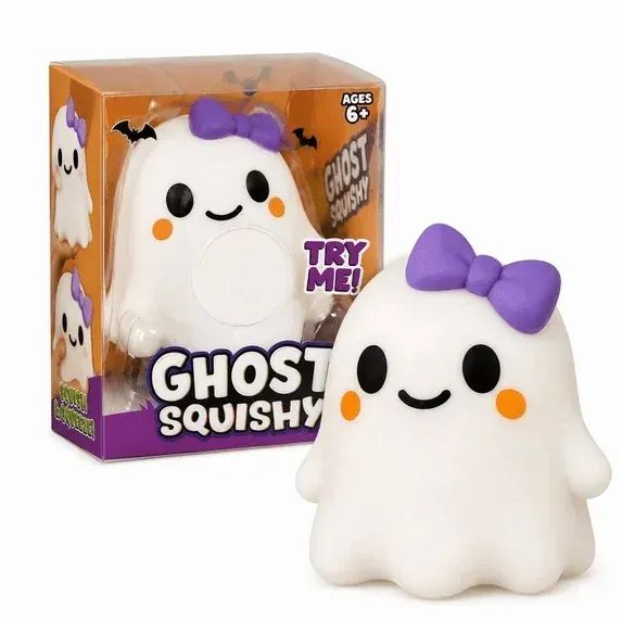 White ghost squishy toy with purple bow beside its box, smiling with orange cheeks and black eyes