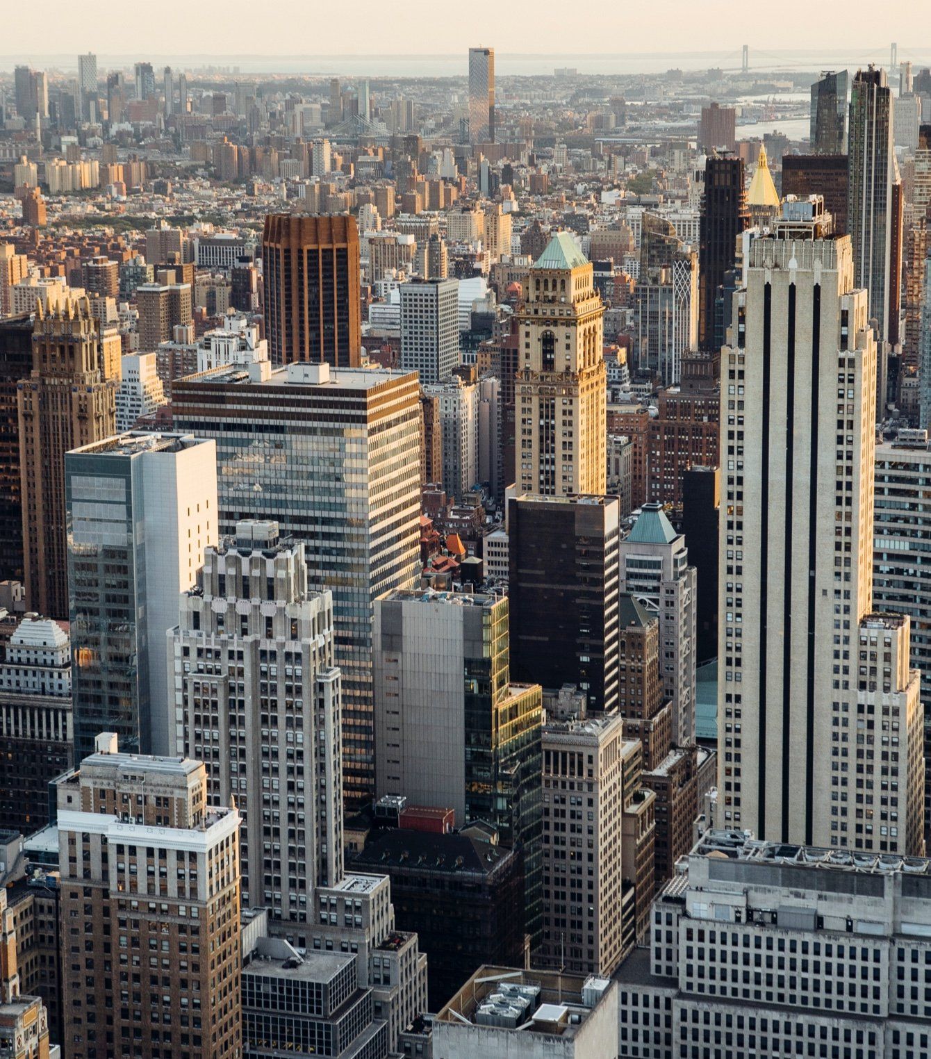 An aerial view of a city with lots of tall buildings