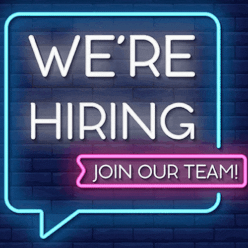 Neon sign on a brick wall reading